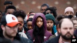 Students gather on their soccer field during a 17-minute walkout protest at the Stivers School for the Arts in Dayton, Ohio, March 14, 2018.
