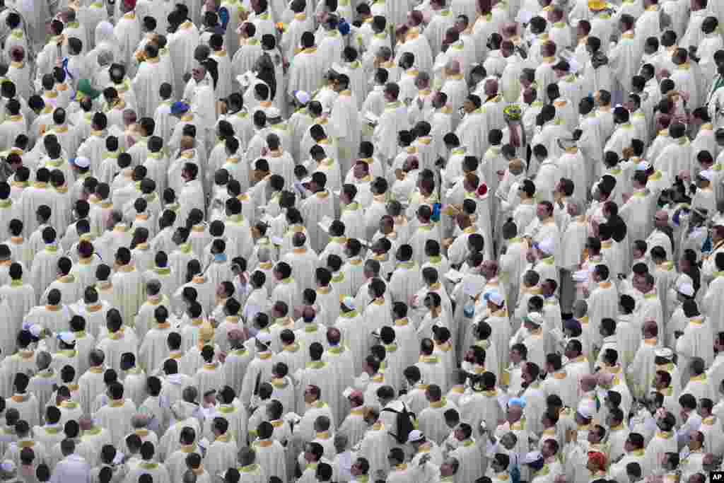 Clergy attend a Mass celebrated by Pope Francis on the Copacabana beachfront, in Rio de Janeiro, July 28, 2013.