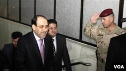 Perdana Menteri Nouri al-Maliki datang menghadiri rapat parlemen Irak di Baghdad, Irak, Senin, 20 Desember 2010.